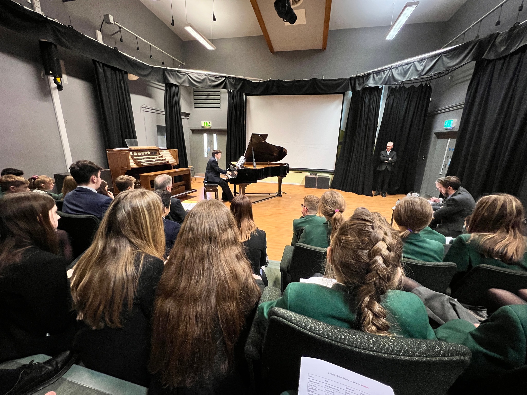 AGC House Music boy playing piano with audience